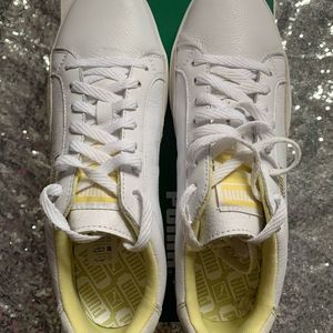 Crisp white puma sneakers